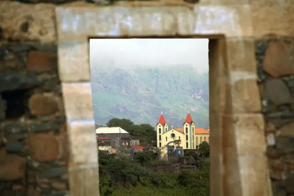 Church framed by a stone doorway in Santiago