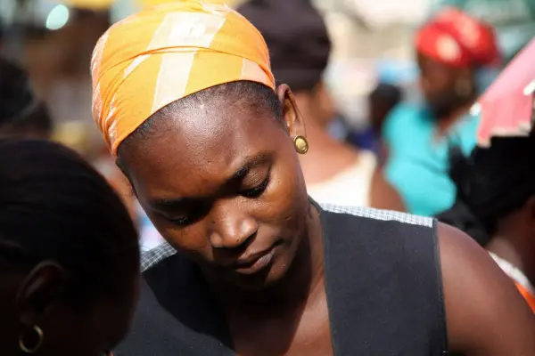 Woman wearing an orange headscarf in Santiago