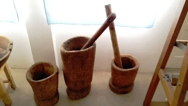 Traditional wooden mortars and pestles on display