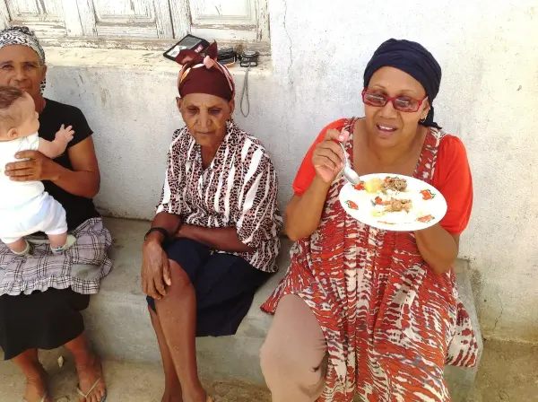 Sharing food at a Bandeira celebration in Fogo